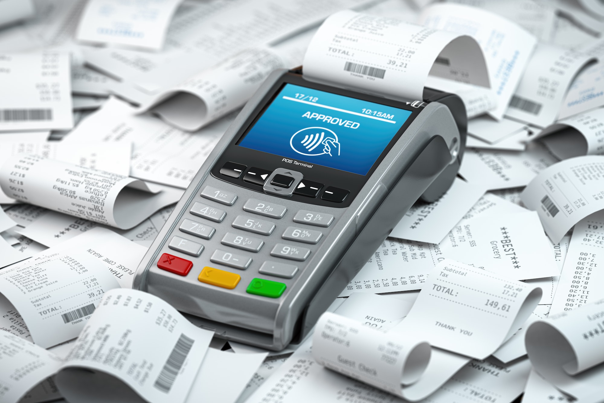 POS terminal in a heap of receipts. Payment for a lot of expenses or purchases concept.